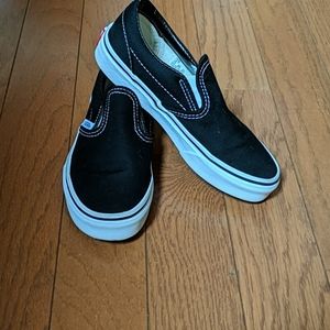 Vans black slip ons